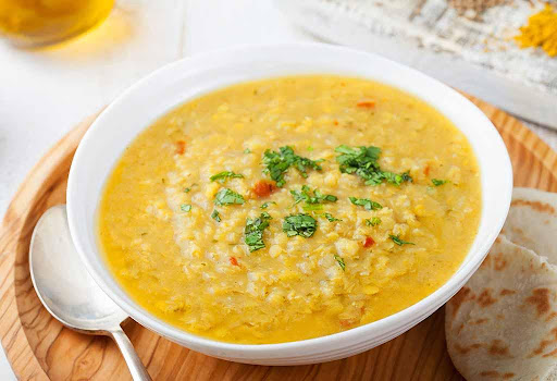 Plate full with moong dal soup